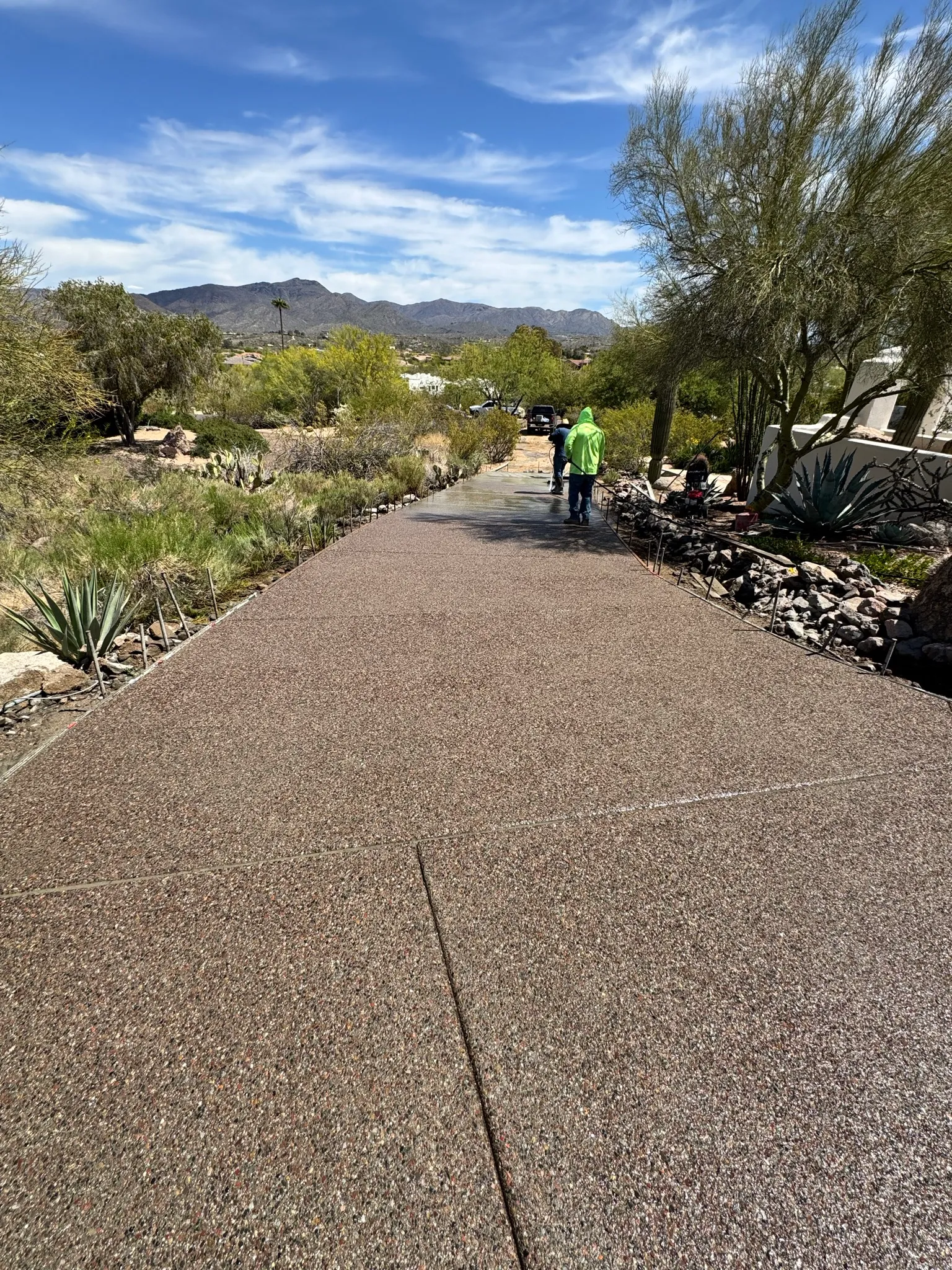 Finished driveway with worker
